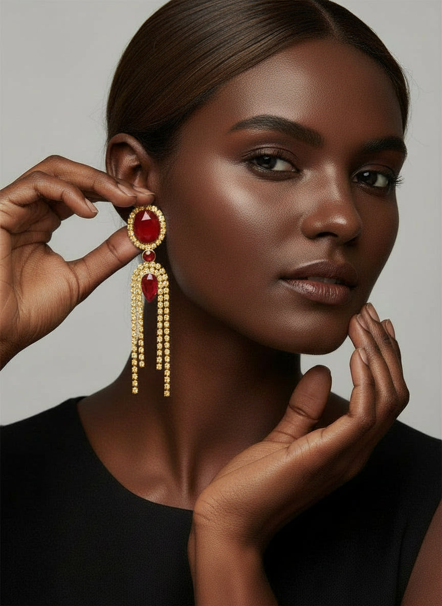 Decorative earrings with red stones and dangling elements 
